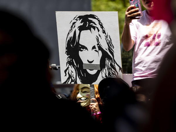 A demonstrator holds a poster showing a portrait of Britney Spears during a #freebritney protest in Los Angeles, California, USA, 23 June 2021. EPA/ETIENNE LAURENT