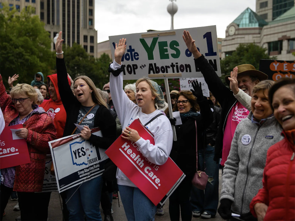 People attend a rally hosted by Ohioans United for Reproductive Rights outside of the Ohio Statehouse