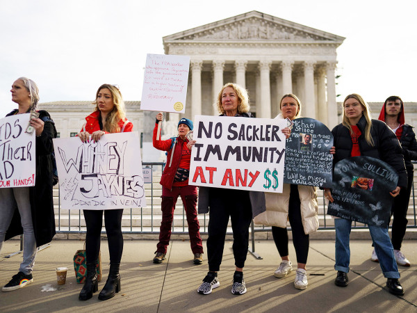 Campaigners and family members of those who have died of opioids gather outside the US Supreme Court, Washington, DC, USA, 04 December 2023.