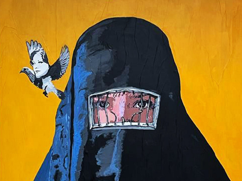 Roma (Italia). Un murale realizzato in via Nomentana, nei pressi dell’ambasciata iraniana, dallo street artist Harry Greb, dal titolo “Iran W”. Una giovane donna avvolta nel burqa ci restituisce uno sguardo attraverso la visiera, rappresentata dalle sbarre rotte di un carcere, da cui spicca il volo una colomba, simbolo di pace (ANSA FOTO)